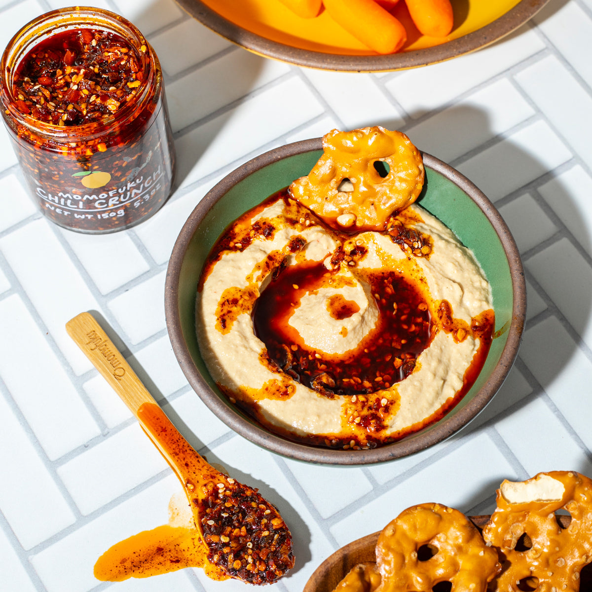 chili crunch with hummus and pretzels