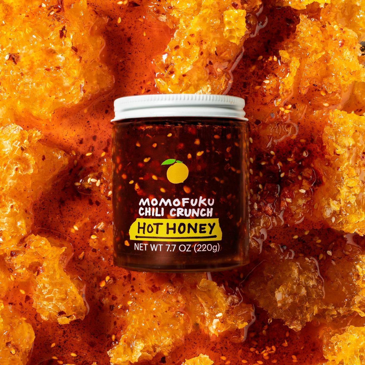 chili crunch jar on top of honeycomb