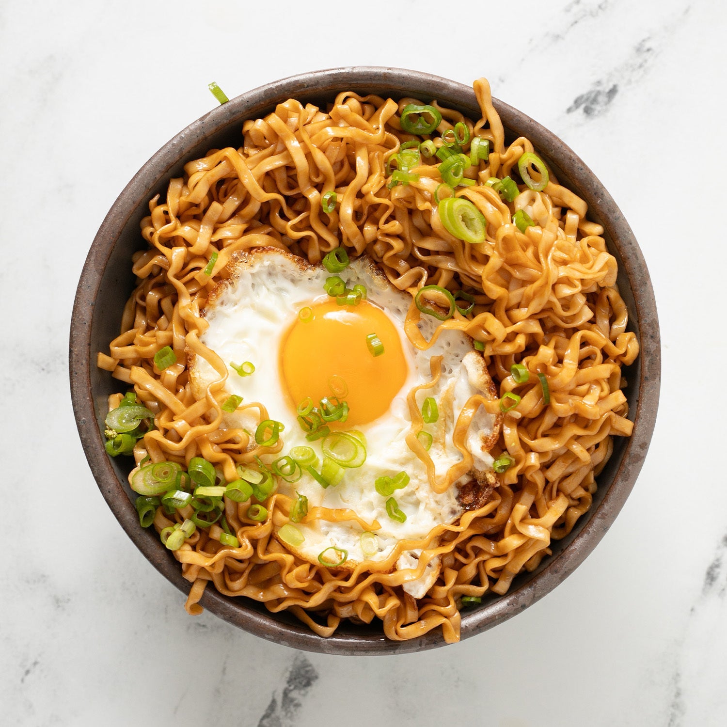 Soy and Scallion Noodle with egg in a bowl