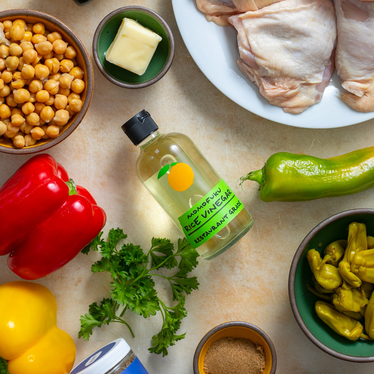 Vinegar with raw ingredients for sheet pan chicken