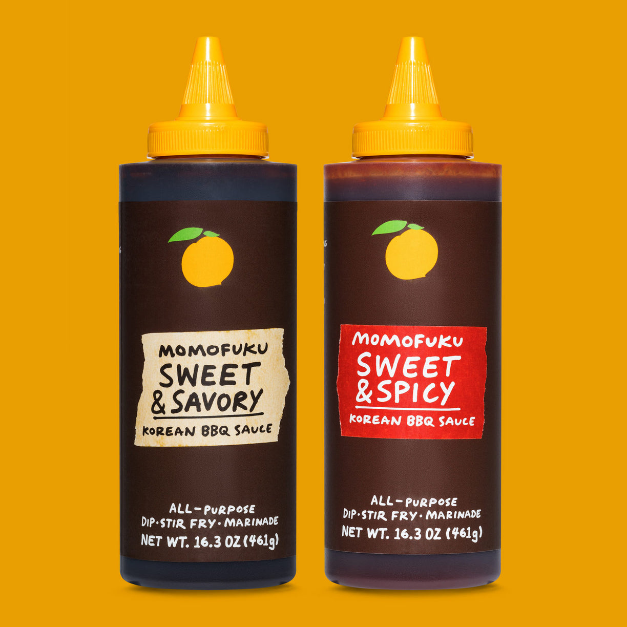 Bottle of Sweet & Savory Korean BBQ Sauce and Bottle of Sweet & Spicy Korean BBQ Sauce on orange background