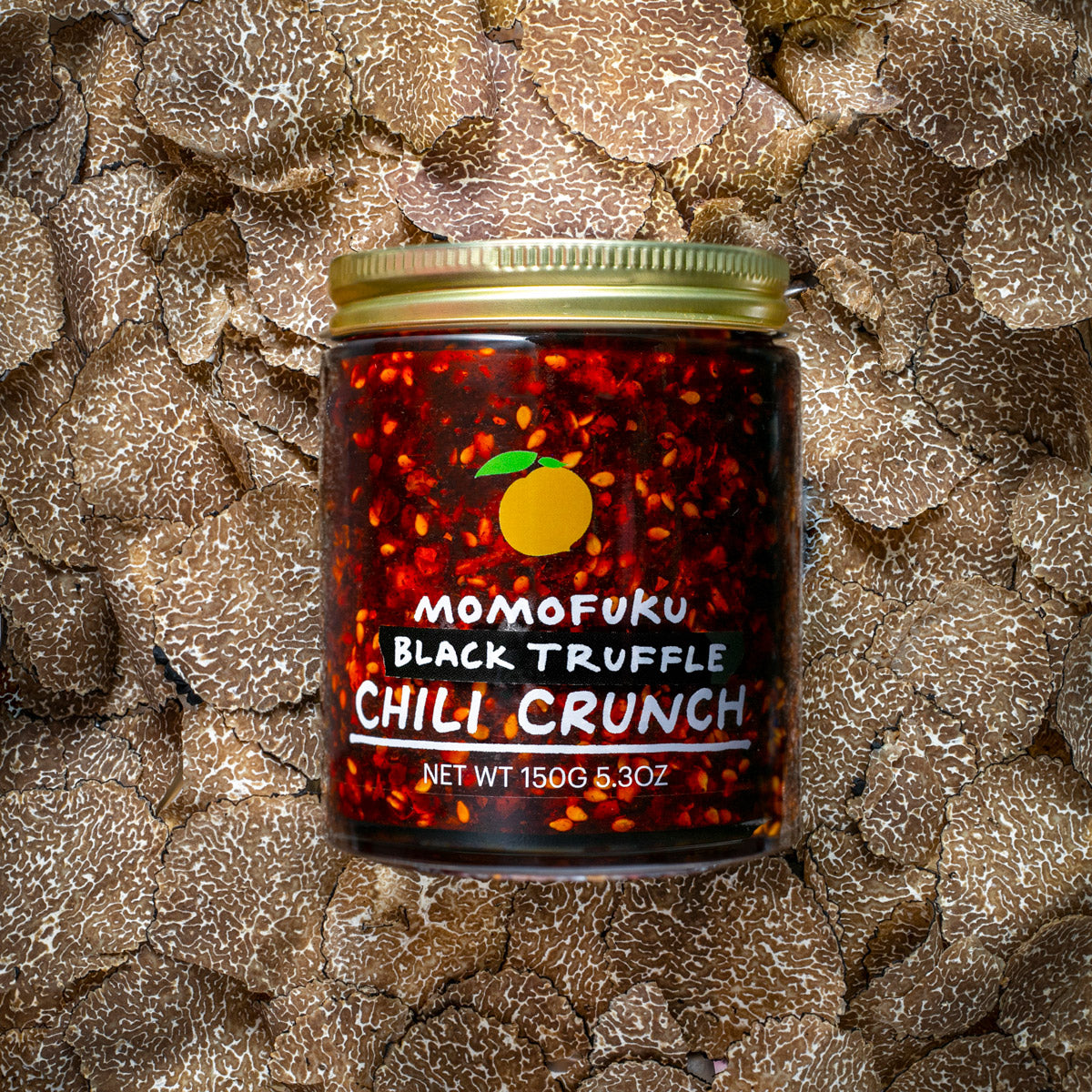 black truffle chili crunch on a bed of truffles